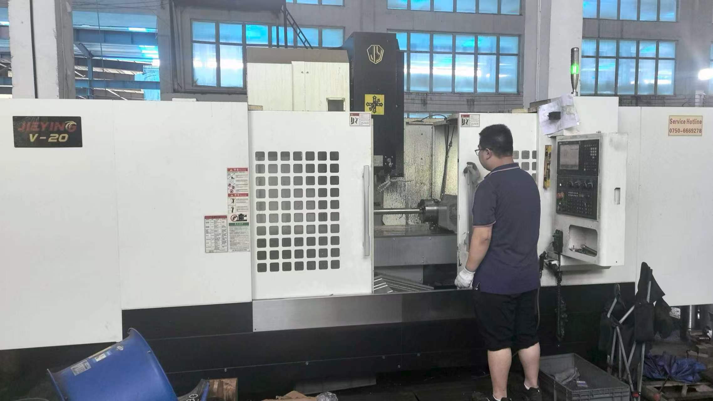 Operator working at CNC machine
